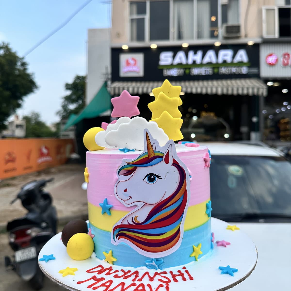 Pink and blue unicorn rainbow cake for a children's birthday